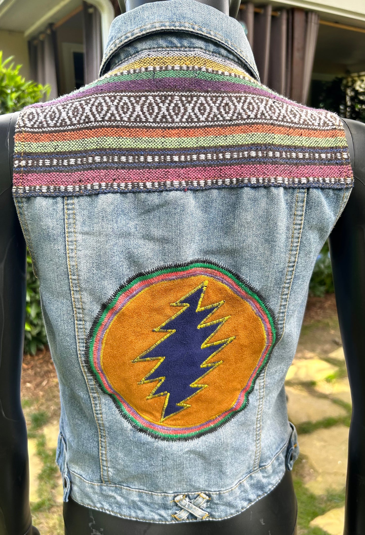 Upcycled Jean vest with leather back patch