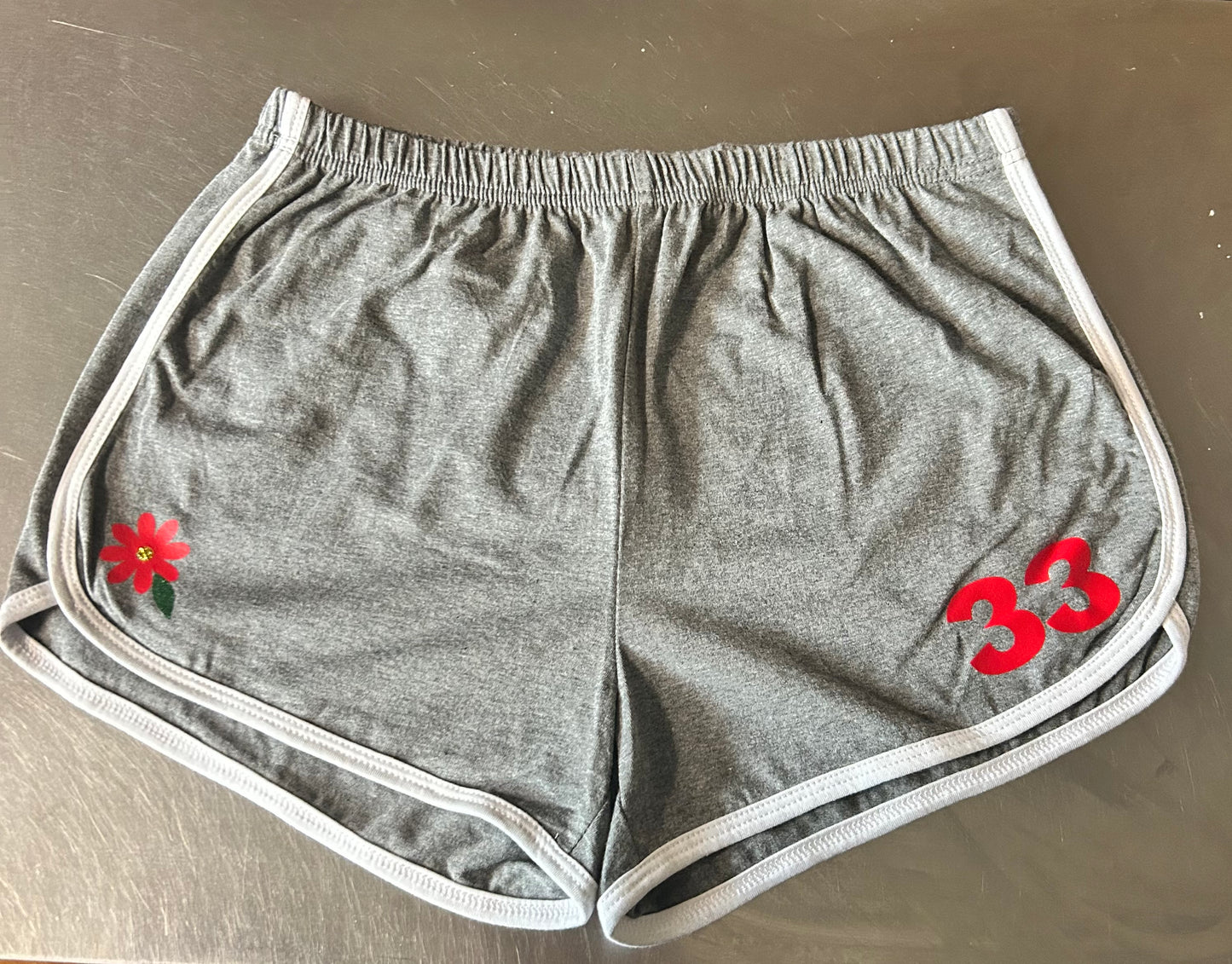 Red daisy gym shorts